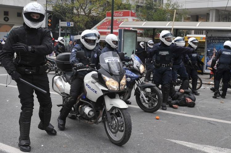 <a><img src="https://www.theepochtimes.com/assets/uploads/2015/09/greece94074639b.jpg" alt="Police detains a demonstrator in central Athens on December 6, 2009 during a massive demonstration commemorating 15-year-old Alexandros Grigoropoulos' fatal shooting a year ago. (Louisa Gouliamaki/AFP/Getty Images)" title="Police detains a demonstrator in central Athens on December 6, 2009 during a massive demonstration commemorating 15-year-old Alexandros Grigoropoulos' fatal shooting a year ago. (Louisa Gouliamaki/AFP/Getty Images)" width="320" class="size-medium wp-image-1824875"/></a>