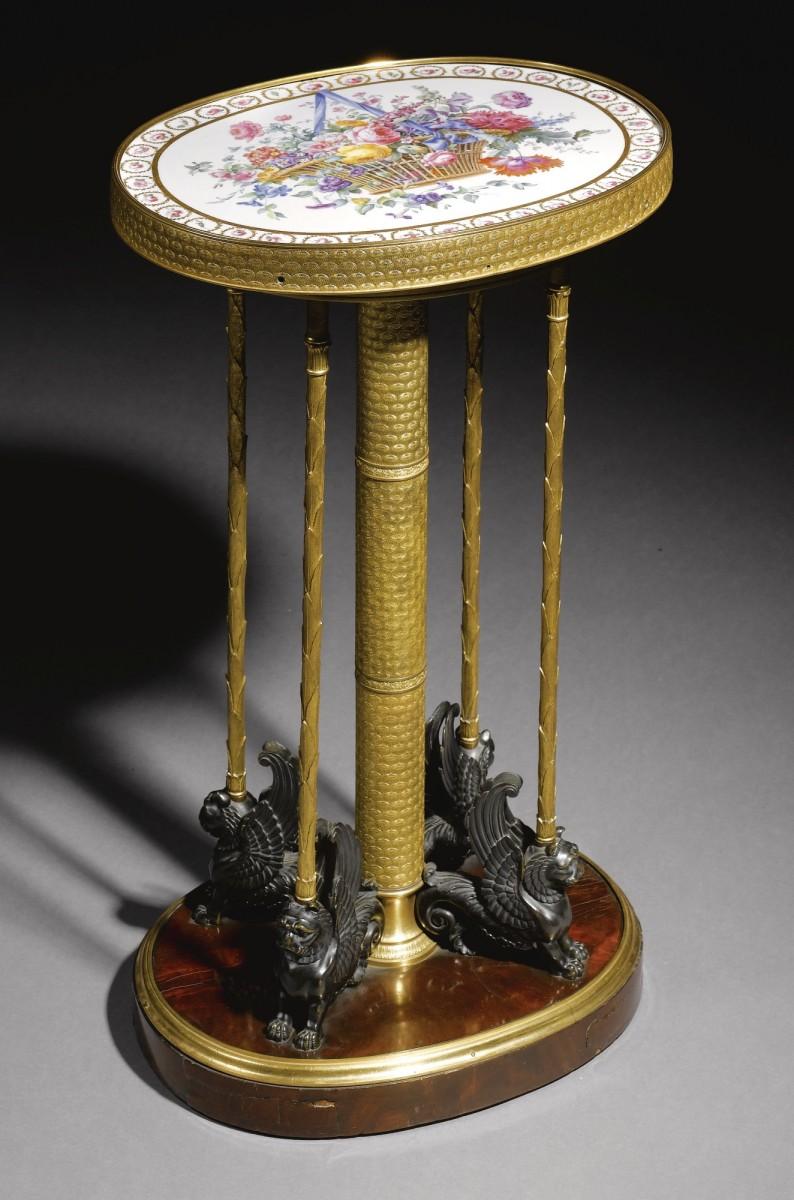 <a><img class="size-large wp-image-1775474" title="A gilt-bronze and patinated-bronze gueridon table. (Courtesy of exhibited by Il Quadrifoglio SRL)" src="https://www.theepochtimes.com/assets/uploads/2015/09/gueridon_Il-Quadrifoglio.jpg" alt="A gilt-bronze and patinated-bronze gueridon table. (Courtesy of exhibited by Il Quadrifoglio SRL)" width="390" height="590"/></a>