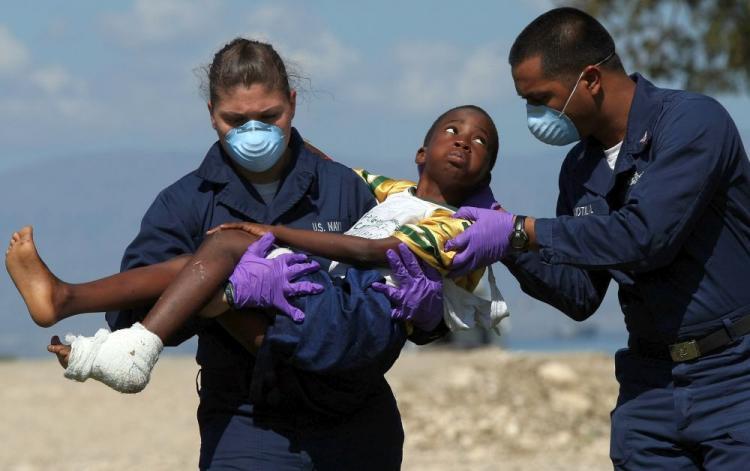 <a><img src="https://www.theepochtimes.com/assets/uploads/2015/09/h95919188+haiti+aid.jpg" alt="A young Haitian boy injured in last week's devastating earthquake is carried by two members of the U.S. Navy to a waiting medical evacuation helicopter for treatment Jan. 21 in Port-au-Prince, Haiti. Aid organizations report shortages and slow mobilization of relief supplies. They say priority aid is being given to the most vulnerable people. (Win McNamee/Getty Images)" title="A young Haitian boy injured in last week's devastating earthquake is carried by two members of the U.S. Navy to a waiting medical evacuation helicopter for treatment Jan. 21 in Port-au-Prince, Haiti. Aid organizations report shortages and slow mobilization of relief supplies. They say priority aid is being given to the most vulnerable people. (Win McNamee/Getty Images)" width="320" class="size-medium wp-image-1823773"/></a>