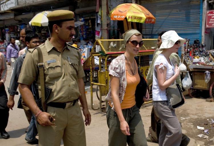 <a><img src="https://www.theepochtimes.com/assets/uploads/2015/09/in98792288+INDIA.jpg" alt="Foreign tourists are watched by an Indian policeman as they walk along a street in New Delhi on May 2. Thousands of Indian police and paramilitary troops are guarding New Delhi's markets and shopping centers after a series of warnings from foreign embassies of an imminent militant attack. (Manpreet Romana/AFP/Getty Images)" title="Foreign tourists are watched by an Indian policeman as they walk along a street in New Delhi on May 2. Thousands of Indian police and paramilitary troops are guarding New Delhi's markets and shopping centers after a series of warnings from foreign embassies of an imminent militant attack. (Manpreet Romana/AFP/Getty Images)" width="320" class="size-medium wp-image-1820397"/></a>