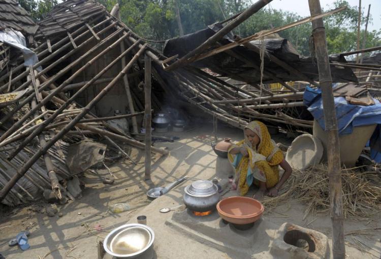 <a><img src="https://www.theepochtimes.com/assets/uploads/2015/09/india98473666.jpg" alt="An Indian woman cooks beside her collapsed hut in the village of Karandighi, some 1000 miles north of Kolkata on April 15. A violent cyclone killed 116 and left hundreds of thousands homeless in northeast India and Bangladesh. The storm took forecasters by surprise, weather officials said. ( Chowdhury/AFP/Getty Images )" title="An Indian woman cooks beside her collapsed hut in the village of Karandighi, some 1000 miles north of Kolkata on April 15. A violent cyclone killed 116 and left hundreds of thousands homeless in northeast India and Bangladesh. The storm took forecasters by surprise, weather officials said. ( Chowdhury/AFP/Getty Images )" width="320" class="size-medium wp-image-1821006"/></a>