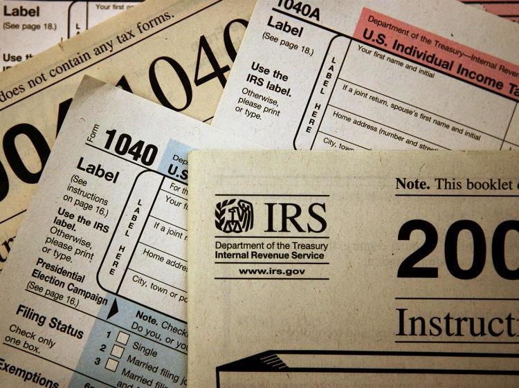 <a><img src="https://www.theepochtimes.com/assets/uploads/2015/09/irs2-56043781.jpg" alt="In a nutshell, the proposed tax preparers' requirements include registration, competency tests, continued professional training, and complying with a set of ethical standards. (Scott Olson/Getty Images)" title="In a nutshell, the proposed tax preparers' requirements include registration, competency tests, continued professional training, and complying with a set of ethical standards. (Scott Olson/Getty Images)" width="320" class="size-medium wp-image-1823922"/></a>