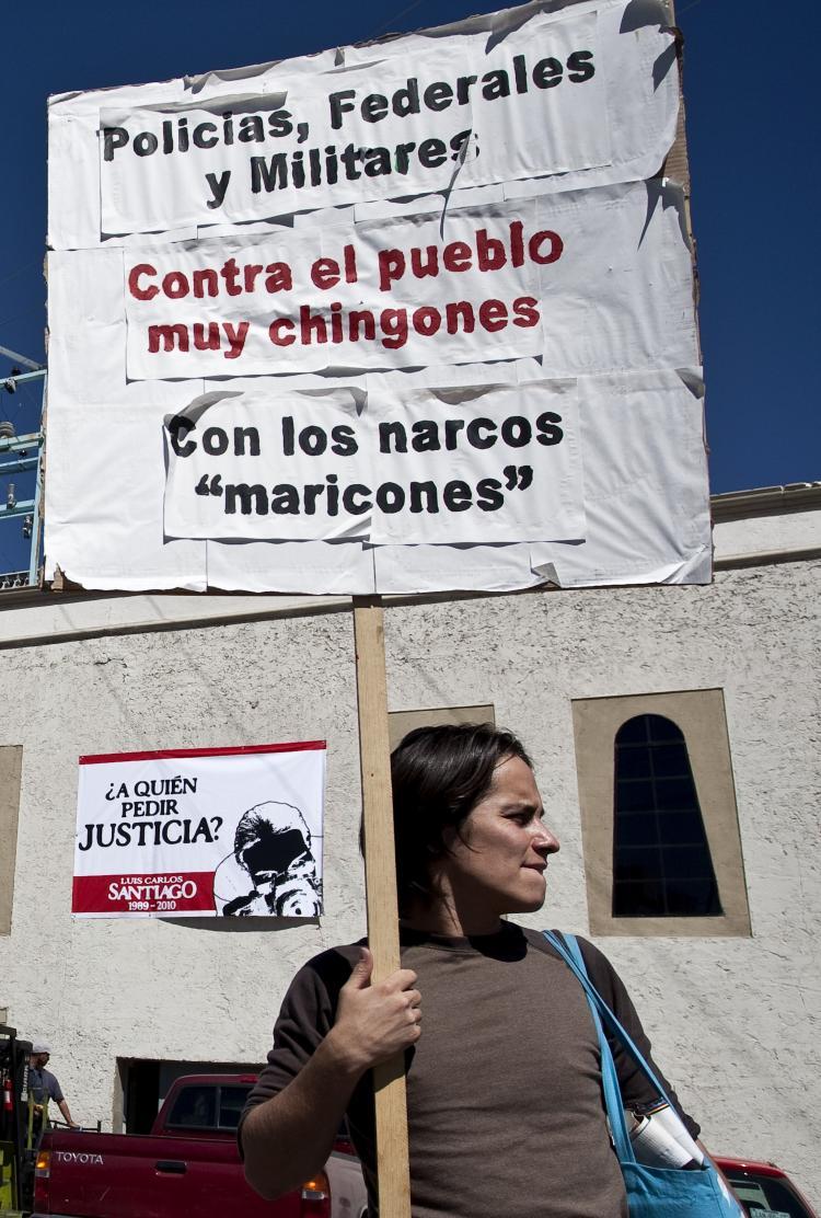 <a><img src="https://www.theepochtimes.com/assets/uploads/2015/09/j105210550.jpg" alt="A man holds a sign in Ciudad Juarez, known as Mexico's murder capital, in front of El Diario de Juarez newspaper on Oct. 12, 2010, during a protest against the murder of 21-year-old photojournalist Luis Carlos Santiago, who worked for the newspaper. (Jesus Alcazar/AFP/Getty Images)" title="A man holds a sign in Ciudad Juarez, known as Mexico's murder capital, in front of El Diario de Juarez newspaper on Oct. 12, 2010, during a protest against the murder of 21-year-old photojournalist Luis Carlos Santiago, who worked for the newspaper. (Jesus Alcazar/AFP/Getty Images)" width="320" class="size-medium wp-image-1810164"/></a>