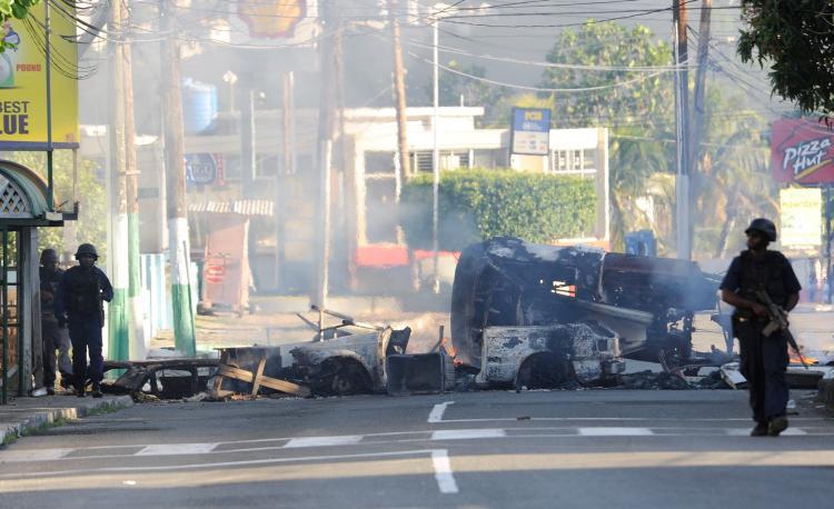 <a><img src="https://www.theepochtimes.com/assets/uploads/2015/09/jamaicaman100369564.jpg" alt="Police patrol on May 24, in Kingston, Jamaica when two police officers were killed after coming under attack amid spreading unrest despite a state of emergency imposed by the government.  (Anthony Foster/Getty Images)" title="Police patrol on May 24, in Kingston, Jamaica when two police officers were killed after coming under attack amid spreading unrest despite a state of emergency imposed by the government.  (Anthony Foster/Getty Images)" width="320" class="size-medium wp-image-1819410"/></a>