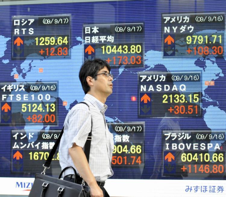 <a><img src="https://www.theepochtimes.com/assets/uploads/2015/09/japan90878544.jpg" alt="A businessman passes before a share prices board in Tokyo. Beijing purchased a net 457 billion yen (US$5.3 billion) of Japanese government debt in June. (Yoshikazu Tsuno/AFP/Getty Images)" title="A businessman passes before a share prices board in Tokyo. Beijing purchased a net 457 billion yen (US$5.3 billion) of Japanese government debt in June. (Yoshikazu Tsuno/AFP/Getty Images)" width="320" class="size-medium wp-image-1816000"/></a>