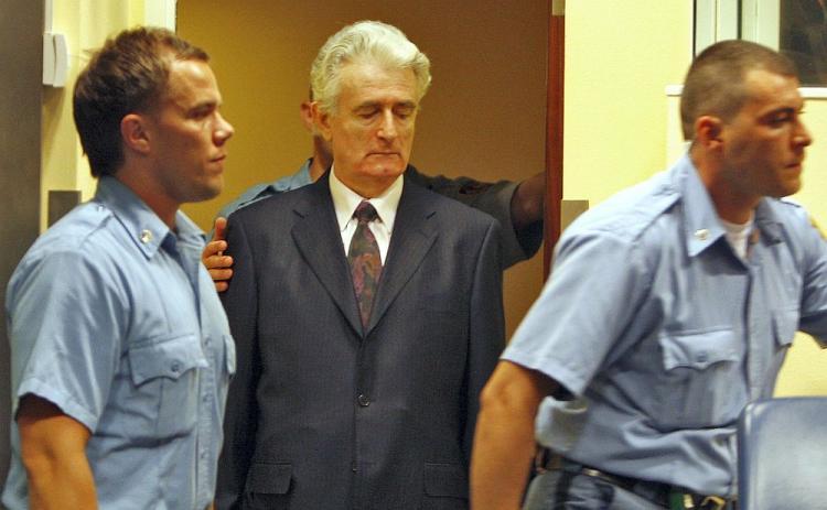 <a><img src="https://www.theepochtimes.com/assets/uploads/2015/09/karadzic-82132988.jpg" alt="Former Bosnian Serb leader Radovan Karadzic (C) enters the courtroom of the International Criminal Tribunal for the Former Yugoslavia at his initial appearance on July 31, 2008, in The Hague. (Jerry Lampen/AFP/Getty Images )" title="Former Bosnian Serb leader Radovan Karadzic (C) enters the courtroom of the International Criminal Tribunal for the Former Yugoslavia at his initial appearance on July 31, 2008, in The Hague. (Jerry Lampen/AFP/Getty Images )" width="320" class="size-medium wp-image-1825451"/></a>