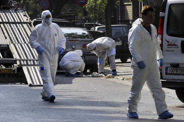<a><img src="https://www.theepochtimes.com/assets/uploads/2015/09/l106515453.jpg" alt="Police investigators search for evidence after the controlled explosion of a package outside of the ACS courier offices in Athens on Nov. 4.  (Louisa Gouliamaki/AFP/Getty Images)" title="Police investigators search for evidence after the controlled explosion of a package outside of the ACS courier offices in Athens on Nov. 4.  (Louisa Gouliamaki/AFP/Getty Images)" width="320" class="size-medium wp-image-1812584"/></a>