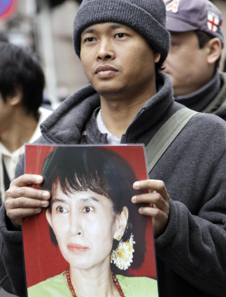 <a><img src="https://www.theepochtimes.com/assets/uploads/2015/09/m85411143.jpg" alt="A Burmese citizen living in Japan holds a portrait of detained pro-democracy icon Aung San Suu Kyi during a rally near the Myanmar Embassy in Tokyo on March 13, 2009, the 21st anniversary of Burma's Human Rights Day. (Yoshikazu Tsuno/AFP/Getty Images)" title="A Burmese citizen living in Japan holds a portrait of detained pro-democracy icon Aung San Suu Kyi during a rally near the Myanmar Embassy in Tokyo on March 13, 2009, the 21st anniversary of Burma's Human Rights Day. (Yoshikazu Tsuno/AFP/Getty Images)" width="320" class="size-medium wp-image-1829578"/></a>