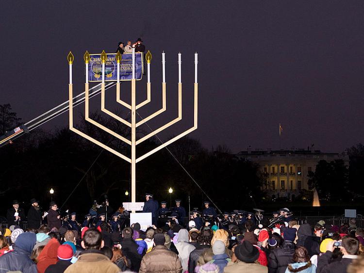 <a><img src="https://www.theepochtimes.com/assets/uploads/2015/09/menorrah1554.jpg" alt="LIGHTING NATIONAL MENORAH: At dusk on Sunday, Dec. 13, the 'National Menorah' was lit. White House Chief of Staff Rahm Emanuel is being lifted in the cherry picker to reach the Hanukkah Menorah, which is said to be the largest in the world. (Lisa Fan/The Epoch Times)" title="LIGHTING NATIONAL MENORAH: At dusk on Sunday, Dec. 13, the 'National Menorah' was lit. White House Chief of Staff Rahm Emanuel is being lifted in the cherry picker to reach the Hanukkah Menorah, which is said to be the largest in the world. (Lisa Fan/The Epoch Times)" width="320" class="size-medium wp-image-1824705"/></a>