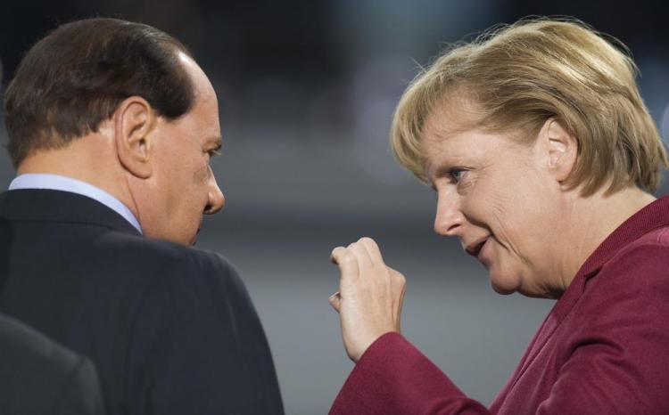<a><img src="https://www.theepochtimes.com/assets/uploads/2015/09/merket91138069.jpg" alt="German Chancellor Angela Merkel (R) speaks with Italian Prime Minister Silvio Berlusconi (L) during the morning G20 plenary session at the Pittsburgh Convention Center in Pittsburgh on September 25, 2009.  (Jim Watson/AFP/Getty Images)" title="German Chancellor Angela Merkel (R) speaks with Italian Prime Minister Silvio Berlusconi (L) during the morning G20 plenary session at the Pittsburgh Convention Center in Pittsburgh on September 25, 2009.  (Jim Watson/AFP/Getty Images)" width="320" class="size-medium wp-image-1826049"/></a>