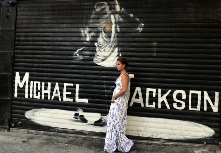 <a><img src="https://www.theepochtimes.com/assets/uploads/2015/09/michael_jackson_103323893.jpg" alt="MICHAEL JACKSON BIRTHDAY: A woman poses in front of a graffiti depicting Michael Jackson at shop's shield at Athens flea market area in Monastiraki in Athens. (Louisa Gouliamaki/AFP/Getty Images)" title="MICHAEL JACKSON BIRTHDAY: A woman poses in front of a graffiti depicting Michael Jackson at shop's shield at Athens flea market area in Monastiraki in Athens. (Louisa Gouliamaki/AFP/Getty Images)" width="320" class="size-medium wp-image-1815409"/></a>