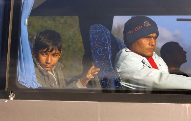 <a><img src="https://www.theepochtimes.com/assets/uploads/2015/09/migrants91016472.jpg" alt="Migrants are transported in coaches by the French police away from a makeshift migrant camp in Calais, France on Sept. 22, 2009.  (Oli Scarff/Getty Images)" title="Migrants are transported in coaches by the French police away from a makeshift migrant camp in Calais, France on Sept. 22, 2009.  (Oli Scarff/Getty Images)" width="320" class="size-medium wp-image-1826047"/></a>