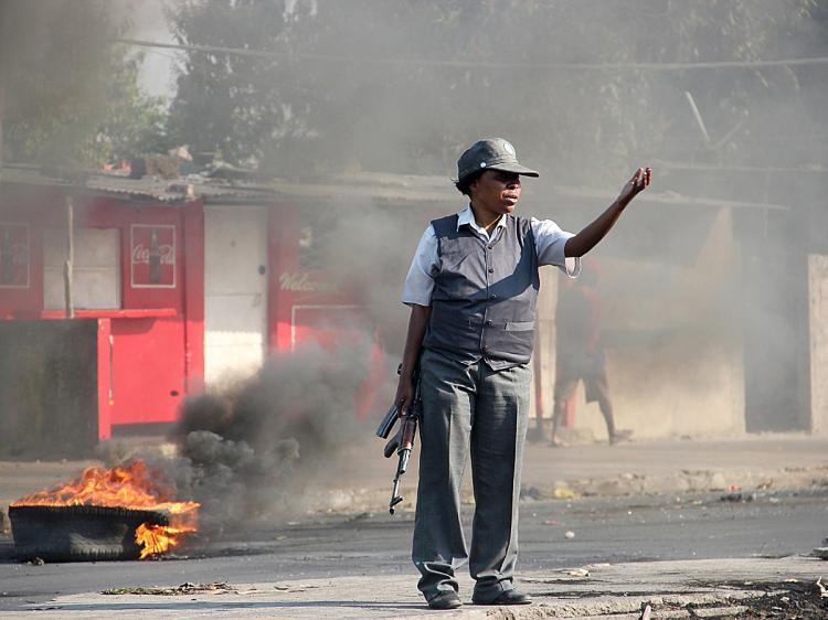 <a><img src="https://www.theepochtimes.com/assets/uploads/2015/09/mozam103801189.jpg" alt="A Mozambiquea police woman gestures on a street of Maputo on September 2, 2010. Fresh clashes between police and demonstrators broke out as violent protests over food and fuel prices moved into a second day. (Arthur Frayer/AFP/Getty Images)" title="A Mozambiquea police woman gestures on a street of Maputo on September 2, 2010. Fresh clashes between police and demonstrators broke out as violent protests over food and fuel prices moved into a second day. (Arthur Frayer/AFP/Getty Images)" width="320" class="size-medium wp-image-1815016"/></a>