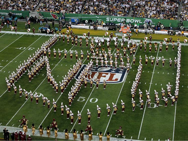 <a><img src="https://www.theepochtimes.com/assets/uploads/2015/09/nfl84667423.jpg" alt="A marching band performs during the pre-game show prior to the start of Super Bowl XLIII between the Arizona Cardinals and the Pittsburgh Steelers on February 1, 2009 at Raymond James Stadium in Tampa, Florida. (Doug Benc/Getty Images)" title="A marching band performs during the pre-game show prior to the start of Super Bowl XLIII between the Arizona Cardinals and the Pittsburgh Steelers on February 1, 2009 at Raymond James Stadium in Tampa, Florida. (Doug Benc/Getty Images)" width="320" class="size-medium wp-image-1824060"/></a>