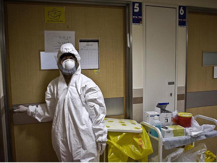 <a><img src="https://www.theepochtimes.com/assets/uploads/2015/09/nurse86356044.jpg" alt="An Israeli nurse at the Tel Aviv Medical Centre prepares to enter the isolated room of a man diagnosed with swine flu in Tel Aviv. (Jonathan Nackstrand/AFP/Getty Images)" title="An Israeli nurse at the Tel Aviv Medical Centre prepares to enter the isolated room of a man diagnosed with swine flu in Tel Aviv. (Jonathan Nackstrand/AFP/Getty Images)" width="320" class="size-medium wp-image-1828435"/></a>