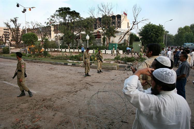 <a><img src="https://www.theepochtimes.com/assets/uploads/2015/09/pakaka82932690.jpg" alt="EVACUATION: People stand next to the crater left by a bomb blast next to the Marriott Hotel in Islamabad after a suicide truck bombing destroyed the hotel. In a recent development, U.N. family members have been evacuated from Pakistan after an escalation  (Pedro Ugarte/AFP/Getty Images)" title="EVACUATION: People stand next to the crater left by a bomb blast next to the Marriott Hotel in Islamabad after a suicide truck bombing destroyed the hotel. In a recent development, U.N. family members have been evacuated from Pakistan after an escalation  (Pedro Ugarte/AFP/Getty Images)" width="320" class="size-medium wp-image-1833481"/></a>