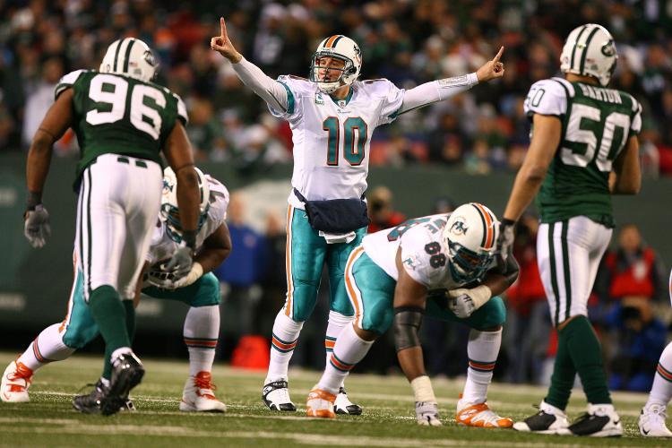 <a><img src="https://www.theepochtimes.com/assets/uploads/2015/09/pennington.jpg" alt="MR. EFFICIENCY: Dolphins QB Chad Pennington directs his team to victory over his former employer. (Al Bello/Getty Images)" title="MR. EFFICIENCY: Dolphins QB Chad Pennington directs his team to victory over his former employer. (Al Bello/Getty Images)" width="320" class="size-medium wp-image-1831998"/></a>
