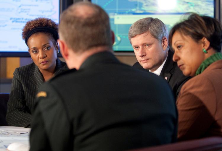 <a><img src="https://www.theepochtimes.com/assets/uploads/2015/09/phmhir.jpg" alt="Prime Minister Stephen Harper, Governor General Michaelle Jean, and Nathalie Gissel-Menos, Charge d'Affaires of the Haitian Diplomatic Mission, receive a briefing from the Chief of the Defence Staff, General Walter Natynczyk, regarding Operation HESTIA, the Canadian Forces humanitarian response to the earthquake disaster in Haiti. (Deb Ransom)" title="Prime Minister Stephen Harper, Governor General Michaelle Jean, and Nathalie Gissel-Menos, Charge d'Affaires of the Haitian Diplomatic Mission, receive a briefing from the Chief of the Defence Staff, General Walter Natynczyk, regarding Operation HESTIA, the Canadian Forces humanitarian response to the earthquake disaster in Haiti. (Deb Ransom)" width="320" class="size-medium wp-image-1824001"/></a>