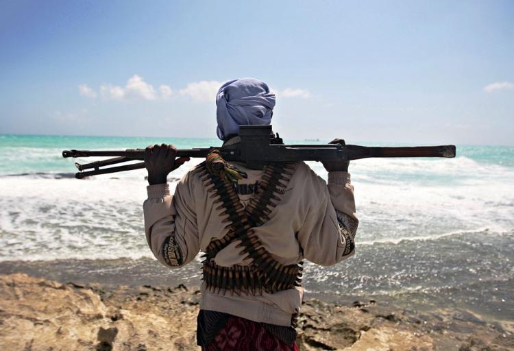 <a><img src="https://www.theepochtimes.com/assets/uploads/2015/09/pirate.jpg" alt="An armed pirate stands on the coastline at Hobyo town in northeastern Somalia. A report of the University of Sonoma in San Francisco says that many of the Somali pirates are bankrupt, outraged fisherman rebelling against the continuous abuse of their fishing grounds by foreign vessels and the dumping of radiactive and toxic waste on their coast. (Mohamed Dahir/AFP/Getty Images)" title="An armed pirate stands on the coastline at Hobyo town in northeastern Somalia. A report of the University of Sonoma in San Francisco says that many of the Somali pirates are bankrupt, outraged fisherman rebelling against the continuous abuse of their fishing grounds by foreign vessels and the dumping of radiactive and toxic waste on their coast. (Mohamed Dahir/AFP/Getty Images)" width="320" class="size-medium wp-image-1822053"/></a>