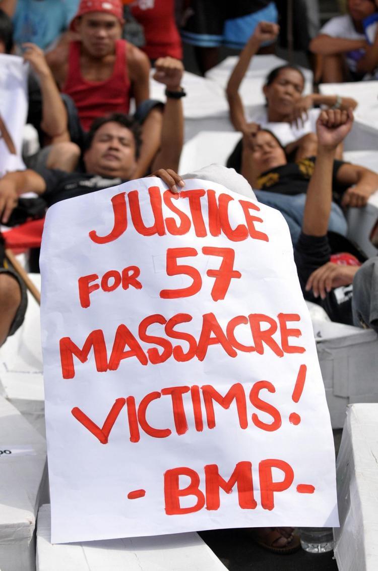 <a><img src="https://www.theepochtimes.com/assets/uploads/2015/09/placard94250981.jpg" alt="A placard is held up as protesters remembering the 57 victims from Nov. 23 massacre in the southern province of Maguindanao rally in front of the National Bureau of Investigation in Manila on Dec. 10 where a principal accused in the killings is currently  (Jay Directo/AFP/Getty Images)" title="A placard is held up as protesters remembering the 57 victims from Nov. 23 massacre in the southern province of Maguindanao rally in front of the National Bureau of Investigation in Manila on Dec. 10 where a principal accused in the killings is currently  (Jay Directo/AFP/Getty Images)" width="320" class="size-medium wp-image-1824772"/></a>