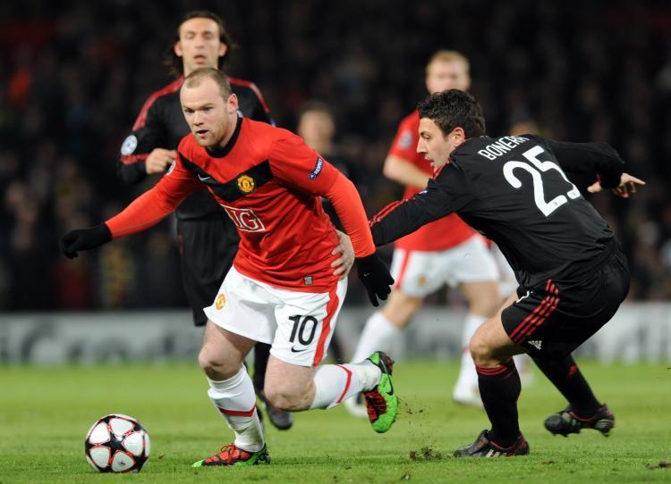 <a><img src="https://www.theepochtimes.com/assets/uploads/2015/09/rooney97614617.jpg" alt="Wayne Rooney and Manchester United were too much for AC Milan to handle on Wednesday in Champions League." title="Wayne Rooney and Manchester United were too much for AC Milan to handle on Wednesday in Champions League." width="320" class="size-medium wp-image-1822233"/></a>