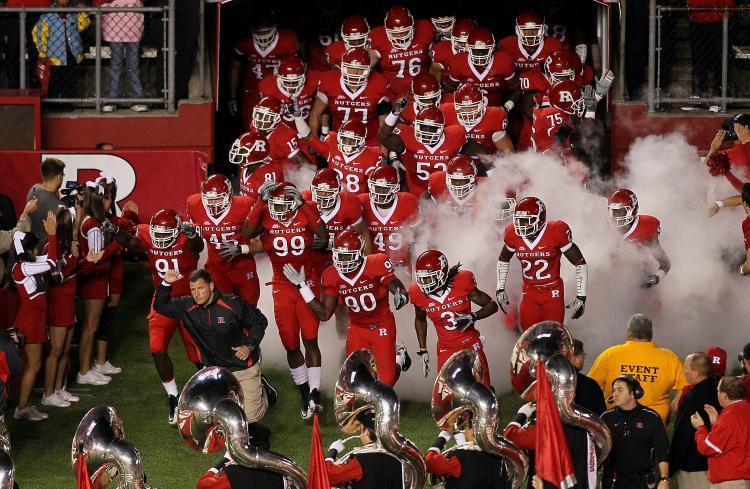<a><img src="https://www.theepochtimes.com/assets/uploads/2015/09/rutgers_105081773.jpg" alt="In this file photo, head coach Greg Schiano of the Rutgers Scarlet Knights leads his team onto the field to play against the Connecticut Huskies. Rutgers's player Eric LeGrand was injured and paralyzed after a tackle during a weekend game against Army. (Jim McIsaac/Getty Images)" title="In this file photo, head coach Greg Schiano of the Rutgers Scarlet Knights leads his team onto the field to play against the Connecticut Huskies. Rutgers's player Eric LeGrand was injured and paralyzed after a tackle during a weekend game against Army. (Jim McIsaac/Getty Images)" width="320" class="size-medium wp-image-1813362"/></a>
