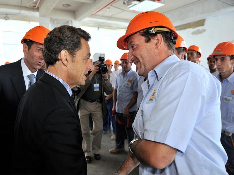 <a><img src="https://www.theepochtimes.com/assets/uploads/2015/09/sarx88755877.jpg" alt="France's President Nicolas Sarkozy (C) shakes hands with French builder Bouygues' employees during a visit of the 'tower First' which is part of the 'Grand Paris' project on June 30, 2009 in La Defense business district near Paris. (Eric Feferberg/AFP/Getty Images)" title="France's President Nicolas Sarkozy (C) shakes hands with French builder Bouygues' employees during a visit of the 'tower First' which is part of the 'Grand Paris' project on June 30, 2009 in La Defense business district near Paris. (Eric Feferberg/AFP/Getty Images)" width="320" class="size-medium wp-image-1827600"/></a>
