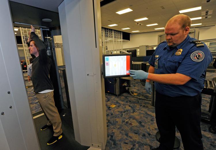 <a><img src="https://www.theepochtimes.com/assets/uploads/2015/09/scanner.jpg" alt="SCANNER UPGRADE: TSA supervisor Nick Fox (R) and another TSA employee demonstrate an advanced image technology (AIT) millimeter wave scanner using new Automated Target Recognition (ATR) software being tested at McCarran International Airport in Las Vegas  (Ethan Miller/Getty Images)" title="SCANNER UPGRADE: TSA supervisor Nick Fox (R) and another TSA employee demonstrate an advanced image technology (AIT) millimeter wave scanner using new Automated Target Recognition (ATR) software being tested at McCarran International Airport in Las Vegas  (Ethan Miller/Getty Images)" width="320" class="size-medium wp-image-1806744"/></a>