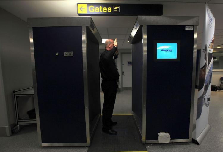 <a><img src="https://www.theepochtimes.com/assets/uploads/2015/09/scanner95622279.jpg" alt="A security officer demonstrates the new full body scanning machine on trial at Manchester Airport on January 7, 2010 in Manchester, England. Last month, ExpressJet pilot Michael Roberts was sent home after refusing the scan and an enhanced pat down.  (Christopher Furlong/Getty Images)" title="A security officer demonstrates the new full body scanning machine on trial at Manchester Airport on January 7, 2010 in Manchester, England. Last month, ExpressJet pilot Michael Roberts was sent home after refusing the scan and an enhanced pat down.  (Christopher Furlong/Getty Images)" width="320" class="size-medium wp-image-1812008"/></a>