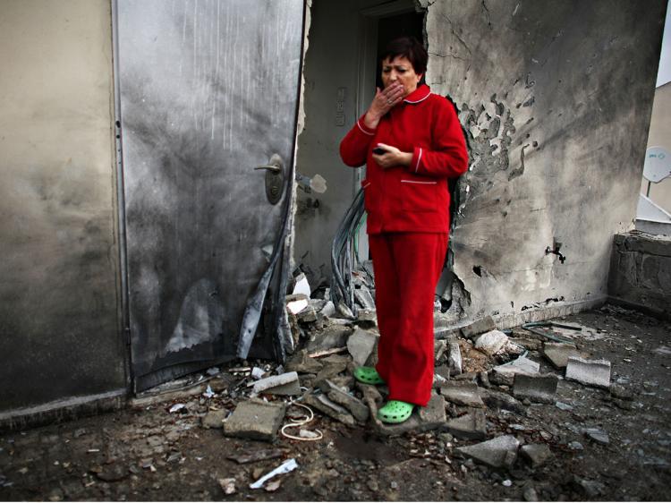 <a><img src="https://www.theepochtimes.com/assets/uploads/2015/09/sderot84101056.jpg" alt="Israeli Maya Iber inspects damage at a her destroyed house after a rocket attack by Palestinian militants on in Sderot, Israel.   (Uriel Sinai/Getty Images)" title="Israeli Maya Iber inspects damage at a her destroyed house after a rocket attack by Palestinian militants on in Sderot, Israel.   (Uriel Sinai/Getty Images)" width="320" class="size-medium wp-image-1831886"/></a>