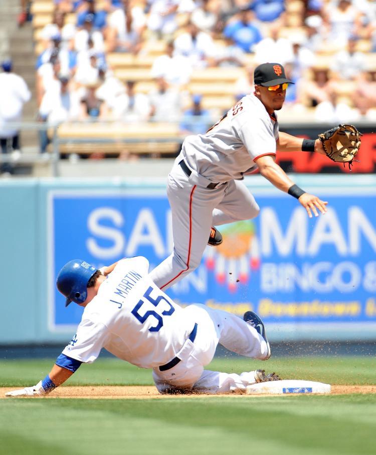 <a><img src="https://www.theepochtimes.com/assets/uploads/2015/09/slide.jpg" alt="HARD SLIDE: Russell Martin of the Dodgers tries to break up a double play by taking out Emmanuel Burriss of the Giants. (Harry How/Getty Images)" title="HARD SLIDE: Russell Martin of the Dodgers tries to break up a double play by taking out Emmanuel Burriss of the Giants. (Harry How/Getty Images)" width="320" class="size-medium wp-image-1826711"/></a>