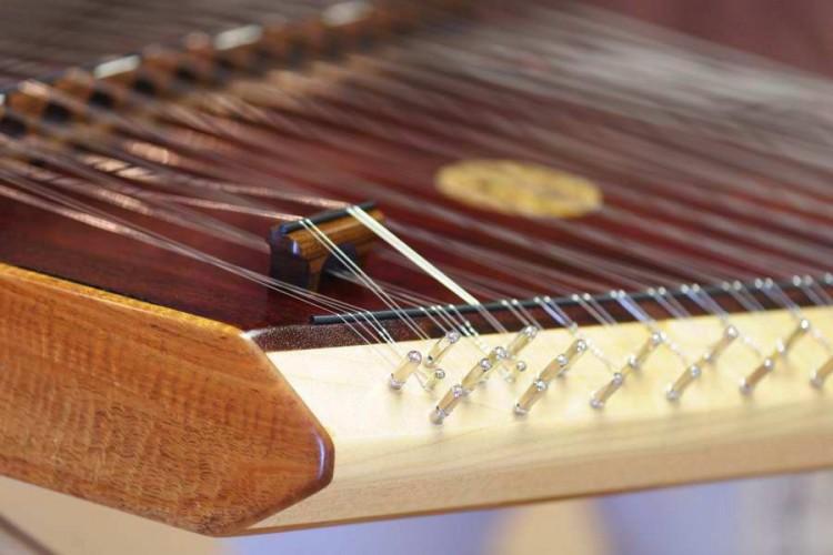 <a><img src="https://www.theepochtimes.com/assets/uploads/2015/09/slide5.jpg" alt="This hammer dulcimer shows the beauty of the Curly Koa wood (brown top rail) and Maple, which holds the tuning pins that secure the metal strings.  (Cat Rooney /The Epoch Times)" title="This hammer dulcimer shows the beauty of the Curly Koa wood (brown top rail) and Maple, which holds the tuning pins that secure the metal strings.  (Cat Rooney /The Epoch Times)" width="320" class="size-medium wp-image-1795555"/></a>