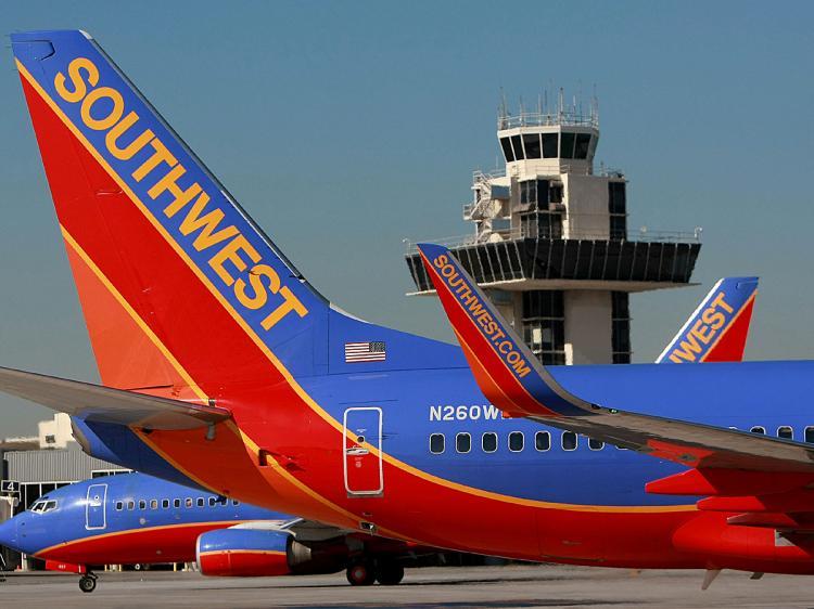 <a><img src="https://www.theepochtimes.com/assets/uploads/2015/09/swest83308248.jpg" alt="Southwest Airlines plans to purchase bankrupt Frontier Airlines. (Justin Sullivan/Getty Images)" title="Southwest Airlines plans to purchase bankrupt Frontier Airlines. (Justin Sullivan/Getty Images)" width="320" class="size-medium wp-image-1806116"/></a>