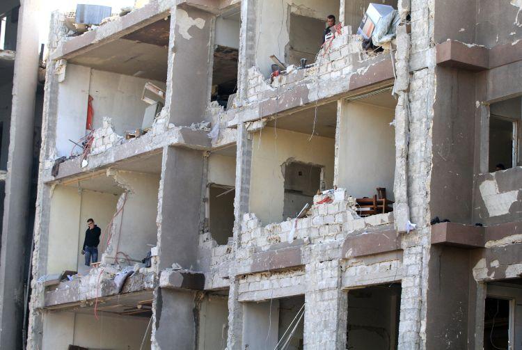 <a><img class="size-large wp-image-1790245" title="The damage to a partially built building" src="https://www.theepochtimes.com/assets/uploads/2015/09/syria-web-141472580.jpg" alt="" width="590" height="395"/></a>