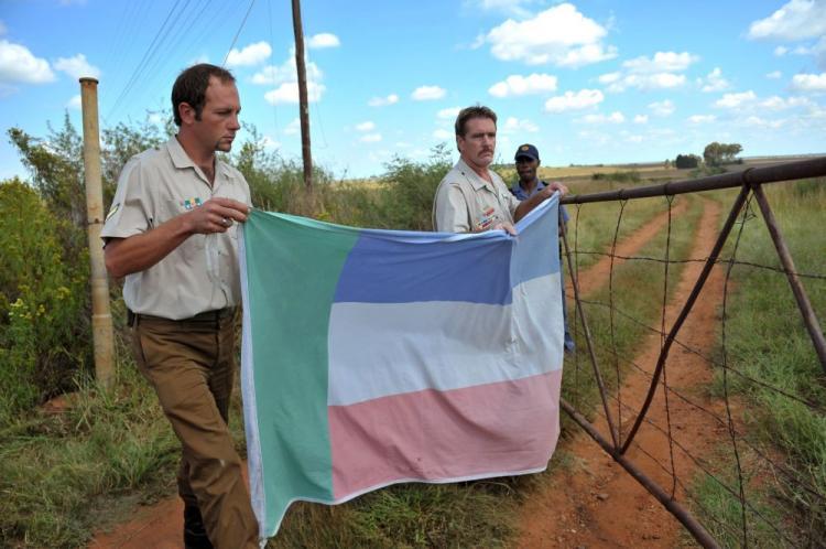 <a><img src="https://www.theepochtimes.com/assets/uploads/2015/09/t98237327+Terreblanche.jpg" alt="Members of the Afrikaner Resistance Movement (AWB) put up the AWB flag on the fence of the farm of white supremacist leader Eugene Terreblanche in Ventersdorp, North West Province of the country on April 4. South African President Jacob Zuma, has appealed for calm after Terreblancheâ��who gained notoriety for campaigning against the end of the racist system of apartheid in the 1980s, was killed on April 3 at the age of 69. The AWB leader was killed in bed on his farm allegedly by two workers after a pay dispute. (Alexander Joe/AFP/Getty Images)" title="Members of the Afrikaner Resistance Movement (AWB) put up the AWB flag on the fence of the farm of white supremacist leader Eugene Terreblanche in Ventersdorp, North West Province of the country on April 4. South African President Jacob Zuma, has appealed for calm after Terreblancheâ��who gained notoriety for campaigning against the end of the racist system of apartheid in the 1980s, was killed on April 3 at the age of 69. The AWB leader was killed in bed on his farm allegedly by two workers after a pay dispute. (Alexander Joe/AFP/Getty Images)" width="320" class="size-medium wp-image-1821460"/></a>