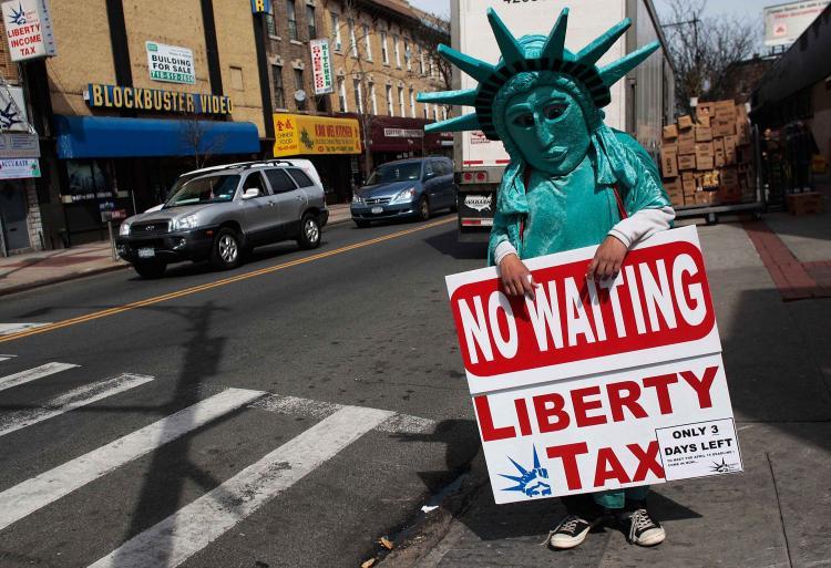 <a><img src="https://www.theepochtimes.com/assets/uploads/2015/09/tax.jpg" alt="TAX MAN: Jonathan Hermosa, dressed up as Statue of Liberty, stands on Myrtle Avenue advertising nearby Liberty Tax service on Monday in the Queens borough of New York City. The U.S. federal tax deadline is midnight April 15, and accountants around the cou (Chris Hondros/Getty Images)" title="TAX MAN: Jonathan Hermosa, dressed up as Statue of Liberty, stands on Myrtle Avenue advertising nearby Liberty Tax service on Monday in the Queens borough of New York City. The U.S. federal tax deadline is midnight April 15, and accountants around the cou (Chris Hondros/Getty Images)" width="320" class="size-medium wp-image-1828763"/></a>