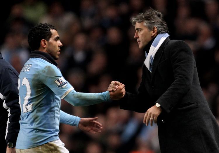 <a><img src="https://www.theepochtimes.com/assets/uploads/2015/09/tevez108056235.jpg" alt="Carlos Tevez and Roberto Mancini are back on good terms after the striker bagged two goals against Wolves on Saturday. (Alex Livesey/Getty Images)" title="Carlos Tevez and Roberto Mancini are back on good terms after the striker bagged two goals against Wolves on Saturday. (Alex Livesey/Getty Images)" width="320" class="size-medium wp-image-1809614"/></a>