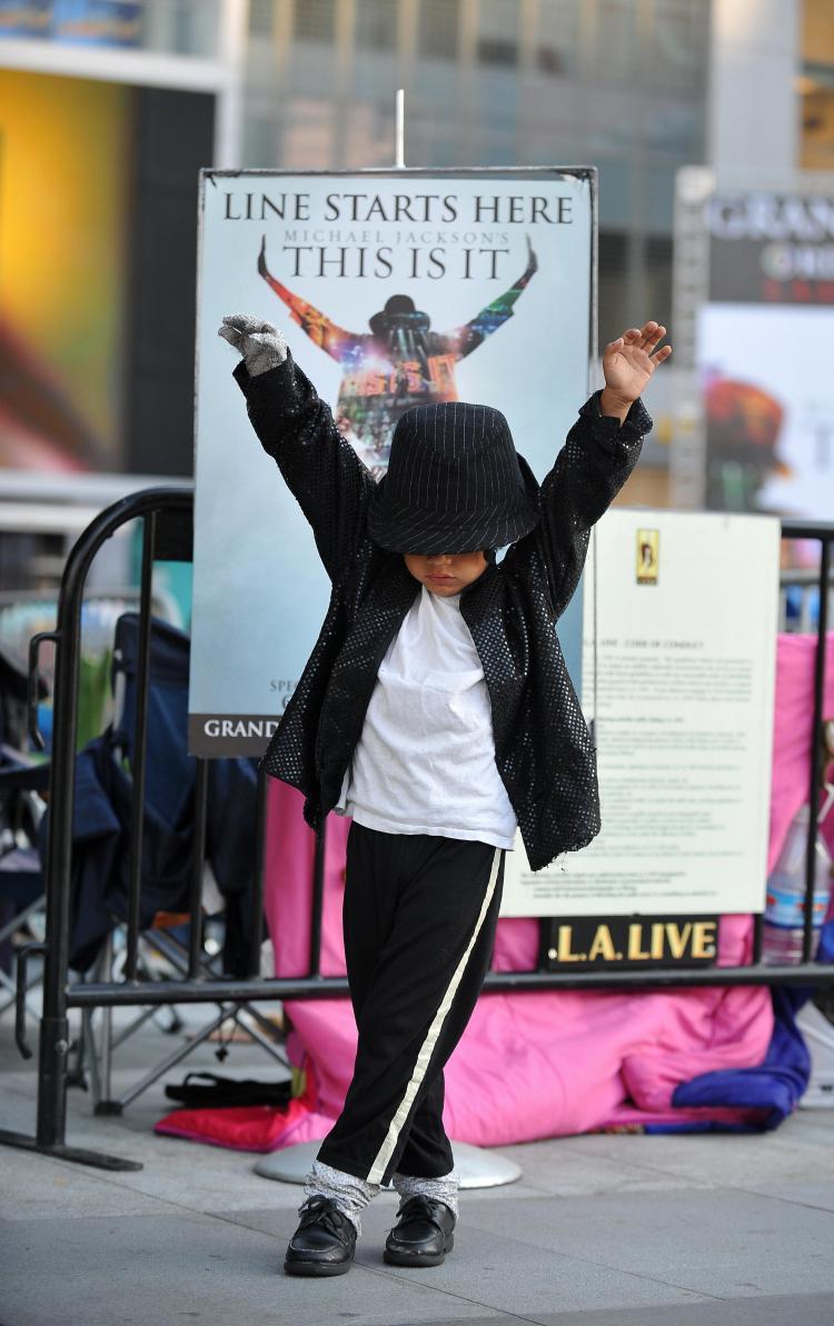 <a><img src="https://www.theepochtimes.com/assets/uploads/2015/09/this_is_it_mj_91204605.jpg" alt="Five-year-old Victor Chupina shows his moves after sleeping outside for a second night to buy tickets to a special pre-screening of the Michael Jackson film 'This Is It,' at LA Live in Los Angeles on September 26. (Robyn Beck/AFP/Getty Images)" title="Five-year-old Victor Chupina shows his moves after sleeping outside for a second night to buy tickets to a special pre-screening of the Michael Jackson film 'This Is It,' at LA Live in Los Angeles on September 26. (Robyn Beck/AFP/Getty Images)" width="320" class="size-medium wp-image-1826037"/></a>