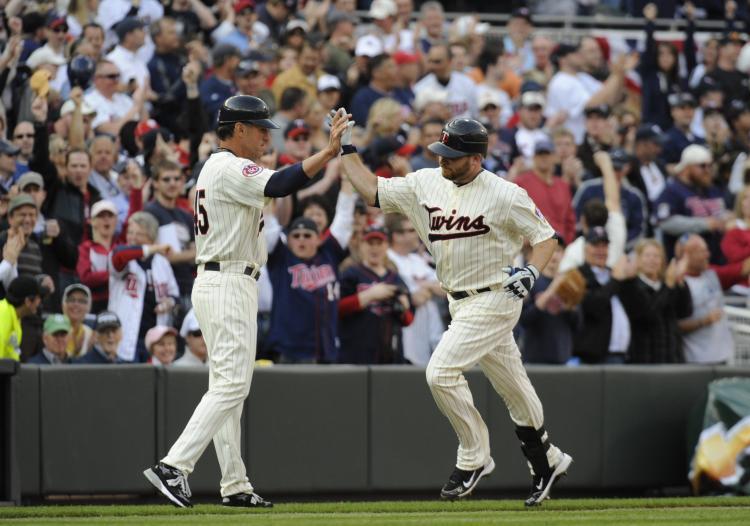 <a><img src="https://www.theepochtimes.com/assets/uploads/2015/09/twins_98451182.jpg" alt="Third base coach Scott Ullger #45 and Jason Kubel #16 of the Minnesota Twins celebrate Kubel hitting the first home run at Target Field in the seventh inning against the Boston Red Sox during the Twins home opener at Target Field in Minneapolis, Minnesota (Hannah Foslien /Getty Images)" title="Third base coach Scott Ullger #45 and Jason Kubel #16 of the Minnesota Twins celebrate Kubel hitting the first home run at Target Field in the seventh inning against the Boston Red Sox during the Twins home opener at Target Field in Minneapolis, Minnesota (Hannah Foslien /Getty Images)" width="320" class="size-medium wp-image-1820973"/></a>