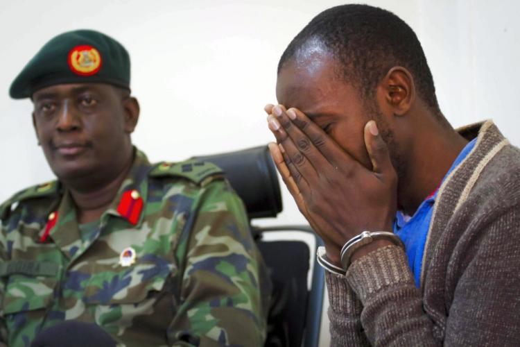 <a><img src="https://www.theepochtimes.com/assets/uploads/2015/09/uganda-103353157.jpg" alt="Idriss Nsobuga (R) weeps at a press conference given by the Ugandan military on Aug. 12. Nsobuga is accused of being part of a group of men that planned the double suicide blasts that killed 74 people on the evening of the football World Cup final on July (Marc Hofer/AFP/Getty Images )" title="Idriss Nsobuga (R) weeps at a press conference given by the Ugandan military on Aug. 12. Nsobuga is accused of being part of a group of men that planned the double suicide blasts that killed 74 people on the evening of the football World Cup final on July (Marc Hofer/AFP/Getty Images )" width="320" class="size-medium wp-image-1816171"/></a>