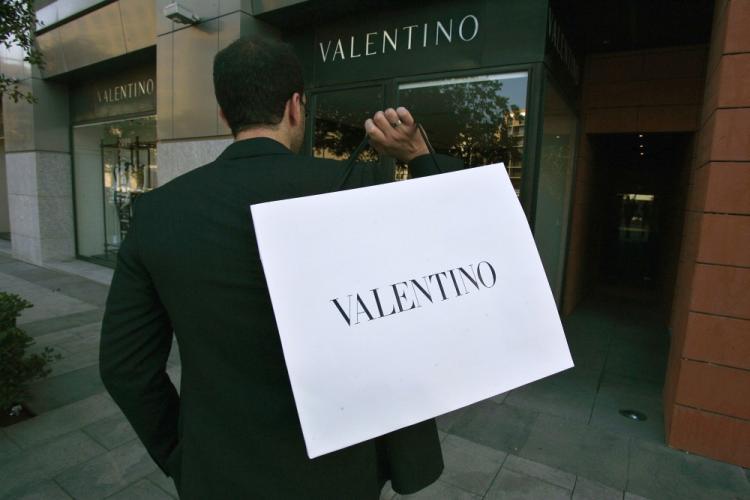 <a><img src="https://www.theepochtimes.com/assets/uploads/2015/09/valentino-bag93435063.jpg" alt="A man carries a Valentino bag as he exits the designer shop in downtown Beirut. Global luxury goods sales have rebounded since the financial crisis, especially in Asia. (Joseph Eid/AFP/Getty Images )" title="A man carries a Valentino bag as he exits the designer shop in downtown Beirut. Global luxury goods sales have rebounded since the financial crisis, especially in Asia. (Joseph Eid/AFP/Getty Images )" width="320" class="size-medium wp-image-1816742"/></a>