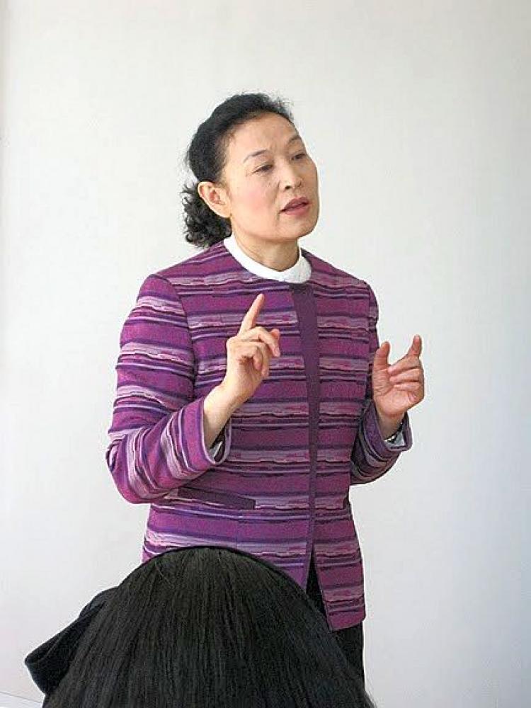 Professor Wang Yan told the travelers that 'We copied systems from the former Soviet Union and the West but it did not work for China.' She told them that China had learned lessons from the past, and had made significant changes to its political structure. (Courtesy of Gwyneth Harold)