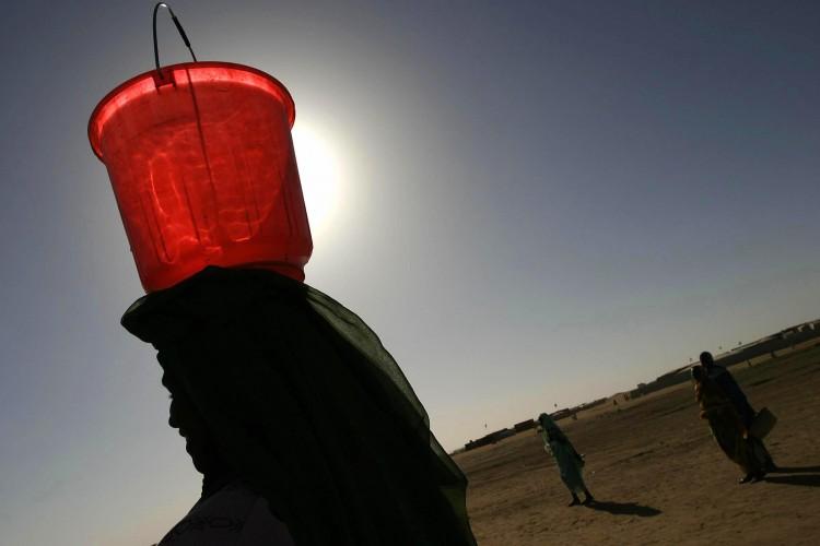 <a><img src="https://www.theepochtimes.com/assets/uploads/2015/09/water.jpg" alt="The picture taken 04 December 2004 shows a displaced Sudanese woman carrying a bucket of water in the Abu Shouk camp on the outskirts of the northern Darfur town of El-Fasher. (Jose Cendon/Getty Images)" title="The picture taken 04 December 2004 shows a displaced Sudanese woman carrying a bucket of water in the Abu Shouk camp on the outskirts of the northern Darfur town of El-Fasher. (Jose Cendon/Getty Images)" width="320" class="size-medium wp-image-1798861"/></a>