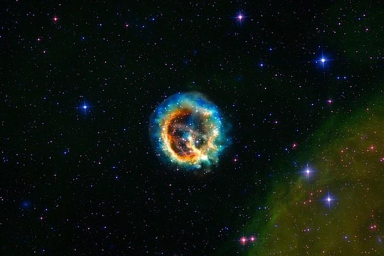 <a href="https://www.theepochtimes.com/assets/uploads/2015/10/catherinewheel.jpg"><img class="size-medium wp-image-1868942" title="CATHERINE WHEEL: Expanding debris cloud from the explosion of a massive star, identified as supernova remnant E0102-72, about 190,000 light-years away in the neighboring galaxy, the Small Magellanic Cloud. (X-ray - NASA / CXC / MIT / D.Dewey et al., NASA / CXC / SAO / J.DePasquale; Optical - NASA / STScI)" src="https://www.theepochtimes.com/assets/uploads/2015/10/catherinewheel.jpg" alt="CATHERINE WHEEL: Expanding debris cloud from the explosion of a massive star, identified as supernova remnant E0102-72, about 190,000 light-years away in the neighboring galaxy, the Small Magellanic Cloud. (X-ray - NASA / CXC / MIT / D.Dewey et al., NASA / CXC / SAO / J.DePasquale; Optical - NASA / STScI)" width="590"/></a>