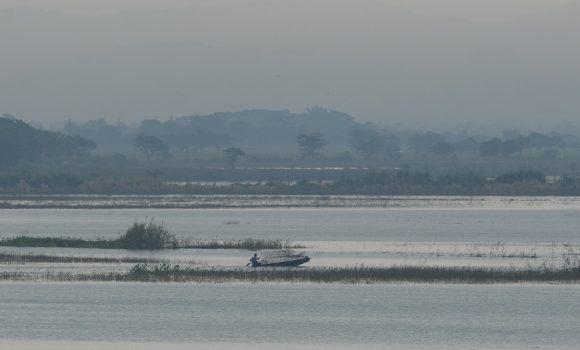 A resident paddles his wooden boat while fishing on a flooded rice field in Candaba town, Pampanga province, north of Manila on October 29, 2015, one week after typhoon Koppu unleashed devastating floods killing at least 54. (TED ALJIBE/AFP/Getty Images)