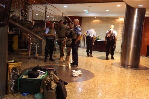 French troops, rear, inside the Radisson Blu hotel after an attack by gunmen on the hotel in Bamako, Mali, Friday, Nov. 20, 2015. Islamic extremists armed with guns and grenades stormed the luxury Radisson Blu hotel in Mali's capital Friday morning, and security forces worked to free guests floor by floor. (AP Photo/Baba Ahmed)