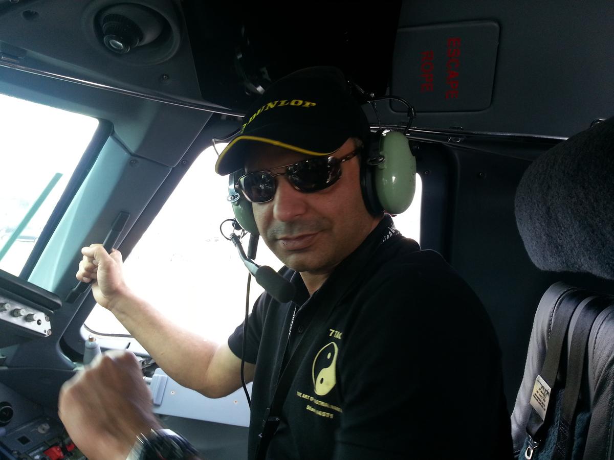 Amar Manzoor, founder of 7Tao, in the cockpit of an Embraer plane. Manzoor and his team developed a system to train businesses on industrial warfare. (Amar Manzoor)