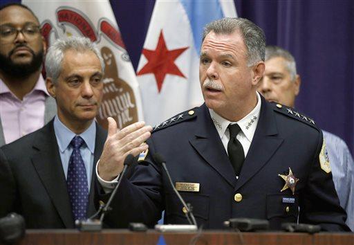 Chicago Police Superintendent Garry McCarthy (R) speaks about first-degree murder charges against police officer Jason Van Dyke in the death of 17-year-old Laquan McDonald, as Mayor Rahm Emanuel (L) looks, on Nov. 24, 2015. (AP Photo/Charles Rex Arbogast)