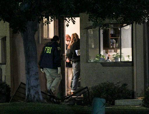 FBI agents search outside a home in connection to the shootings in San Bernardino, Thursday, Dec. 3, 2015, in Redlands, Calif. (AP Photo/Ringo H.W. Chiu)