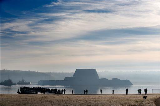 The first Zumwalt-class destroyer, the largest ever built for the U.S. Navy, heads down the Kennebec River after leaving Bath Iron Works, Monday, Dec. 7, 2015, in Bath, Maine. (AP Photo/Robert F. Bukaty)